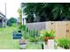 Spacious backyard with a privacy fence, garden area, and lush lawn for outdoor enjoyment at 10 Riker St, Charleston, SC 29403