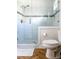 Bathroom featuring a glass shower and a low-flow toilet at 10 Riker St, Charleston, SC 29403