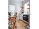 Cozy dining area featuring a table with floral chairs, oven, and open shelving at 10 Riker St, Charleston, SC 29403