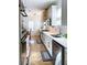 Modern kitchen featuring stainless steel appliances, white cabinets, and a stylish backsplash at 10 Riker St, Charleston, SC 29403