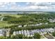 Panoramic aerial view of neighborhood with marsh views and a distant bridge at 1052 Avenue Of Oaks, Charleston, SC 29407