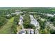 Aerial view of a neighborhood surrounded by lush trees and water at 1052 Avenue Of Oaks, Charleston, SC 29407