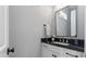 Powder room with black marble countertop and modern rectangular mirror at 1052 Avenue Of Oaks, Charleston, SC 29407