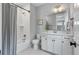 Bright bathroom features a shower/tub combo with subway tile, a stylish vanity with lots of storage, and modern fixtures at 1052 Avenue Of Oaks, Charleston, SC 29407