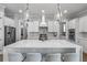 Gorgeous kitchen showcasing white cabinets, stainless steel appliances, a large island, and stylish pendant lights at 1052 Avenue Of Oaks, Charleston, SC 29407