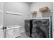 Well-lit laundry room with new washer, dryer, and patterned floor at 1052 Avenue Of Oaks, Charleston, SC 29407