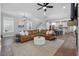 Open-concept living area showcasing a plush sectional sofa with views of the staircase and kitchen at 1052 Avenue Of Oaks, Charleston, SC 29407
