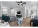 Bright living space featuring hardwood floors, ceiling fans, modern furniture, and lots of natural light from the many windows at 1052 Avenue Of Oaks, Charleston, SC 29407