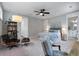 Spacious bedroom with a seating area, a large bed, and two entryways, one leading to an ensuite bath at 1052 Avenue Of Oaks, Charleston, SC 29407