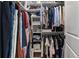 Walk-in closet with hanging rods, clothing, and shelves at 1052 Avenue Of Oaks, Charleston, SC 29407