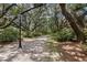 Scenic walking path shaded by large oak trees and lush greenery at 1052 Avenue Of Oaks, Charleston, SC 29407