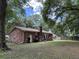 A large backyard featuring lush greenery and mature trees, perfect for outdoor activities and relaxation at 1056 Yorktown Dr, Charleston, SC 29412