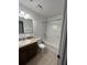 Bright bathroom featuring a shower-tub combo, single vanity, and neutral tile flooring at 1056 Yorktown Dr, Charleston, SC 29412