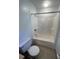 Full bath with a shower-tub combo, toilet, and neutral tile flooring at 1056 Yorktown Dr, Charleston, SC 29412