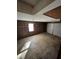 Spacious two car garage featuring concrete flooring, wood paneling, and natural light at 1056 Yorktown Dr, Charleston, SC 29412