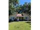 Charming one-story home featuring blue shutters, a well-manicured lawn, and mature trees at 106 Teddy Ct, Summerville, SC 29485
