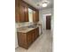 Kitchen with wooden cabinets, tile flooring, and stainless steel appliances at 106 Teddy Ct, Summerville, SC 29485