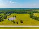 Expansive land with a tranquil pond and lush greenery, perfect for a peaceful retreat at 1133 Highway 311, Cross, SC 29436