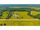 Extensive aerial view featuring a pond, open fields, and lush greenery near a road at 1133 Highway 311, Cross, SC 29436