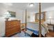 Bedroom with a four-poster bed, hardwood floors and complemented by classic decor at 1133 Highway 311, Cross, SC 29436