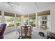 Sunroom dining area with many windows and outside view at 1133 Highway 311, Cross, SC 29436