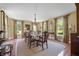 Formal dining room featuring hardwood floors, chandelier, and natural light at 1133 Highway 311, Cross, SC 29436