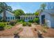 Charming garden area featuring a small fountain between the house and a cottage at 1133 Highway 311, Cross, SC 29436