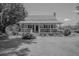 Charming cottage-style home with a manicured front lawn and classic architectural details at 1133 Highway 311, Cross, SC 29436