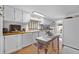 Bright white kitchen with wood counters, island, and modern appliances at 1133 Highway 311, Cross, SC 29436