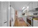 Functional kitchen with wood floors, white cabinets and stainless steel range at 1133 Highway 311, Cross, SC 29436