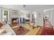 Inviting living room with a fireplace, cozy seating, and natural light at 1133 Highway 311, Cross, SC 29436