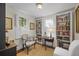 Charming office space featuring custom built-ins, plantation shutters and a sunny window at 1133 Highway 311, Cross, SC 29436