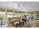 Bright sunroom filled with natural light and comfortable seating at 1133 Highway 311, Cross, SC 29436