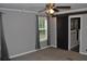 Bright bedroom with modern ceiling fan and sliding barn door to the bathroom at 123 Christina Ln, Summerville, SC 29483