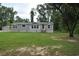 Well-maintained home with green lawn, showcasing its curb appeal with lots of space at 123 Christina Ln, Summerville, SC 29483