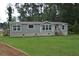 Charming single-story home with a well-manicured lawn, offering a peaceful setting and a welcoming curb appeal at 123 Christina Ln, Summerville, SC 29483