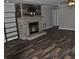 The focal point of this living room is the stone fireplace with rustic wood accents at 123 Christina Ln, Summerville, SC 29483