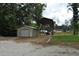 Detached garage and covered shed sit on a well maintained lot at 123 Christina Ln, Summerville, SC 29483
