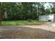 Large yard with a small outbuilding on a partially gravel lot at 123 Christina Ln, Summerville, SC 29483