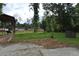 Mature trees and a small building are the features of this partially gravel lot at 123 Christina Ln, Summerville, SC 29483