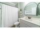 Clean bathroom with a stylish vanity, modern fixtures, and a shower with white curtain at 1250 Hammrick Ln, Johns Island, SC 29455