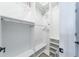Bright, walk-in closet features custom shelving and ample storage space with multiple hanging rods at 1250 Hammrick Ln, Johns Island, SC 29455
