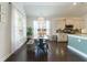 Eat-in kitchen with views of the yard from the dining area featuring a modern chandelier, and hardwood floors at 1250 Hammrick Ln, Johns Island, SC 29455