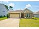 Charming brick home featuring a manicured lawn, two-car garage, and inviting front porch at 1250 Hammrick Ln, Johns Island, SC 29455