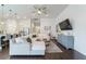 Open living space features hardwood floors, a shiplap accent wall, and transitions seamlessly into the kitchen at 1250 Hammrick Ln, Johns Island, SC 29455