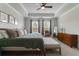 Bright main bedroom boasts a tray ceiling, neutral decor, and large windows with natural light at 1250 Hammrick Ln, Johns Island, SC 29455