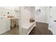 Functional mud room featuring a bench, coat hooks, and laundry appliances at 1250 Hammrick Ln, Johns Island, SC 29455