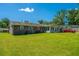 A spacious backyard offers ample green space and features a brick house at 127 Rahway Rd, Goose Creek, SC 29445