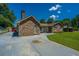 Charming single-story brick home with a well-manicured lawn and long driveway at 127 Rahway Rd, Goose Creek, SC 29445
