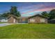 Charming brick home featuring a large front yard and traditional architectural details at 127 Rahway Rd, Goose Creek, SC 29445